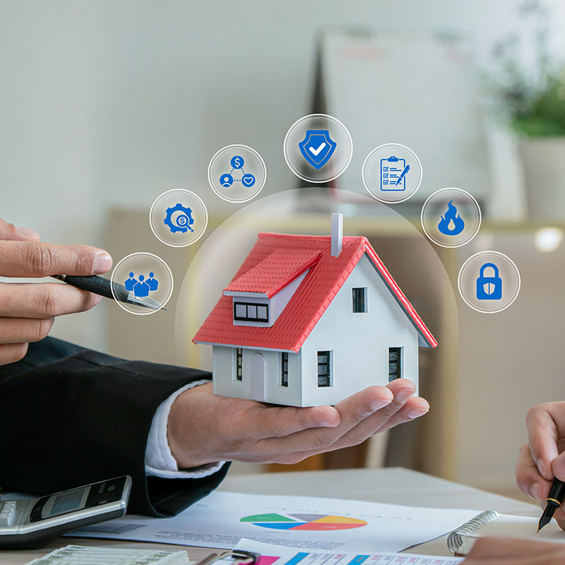 Man insurance agent holding house model with home insurance icon